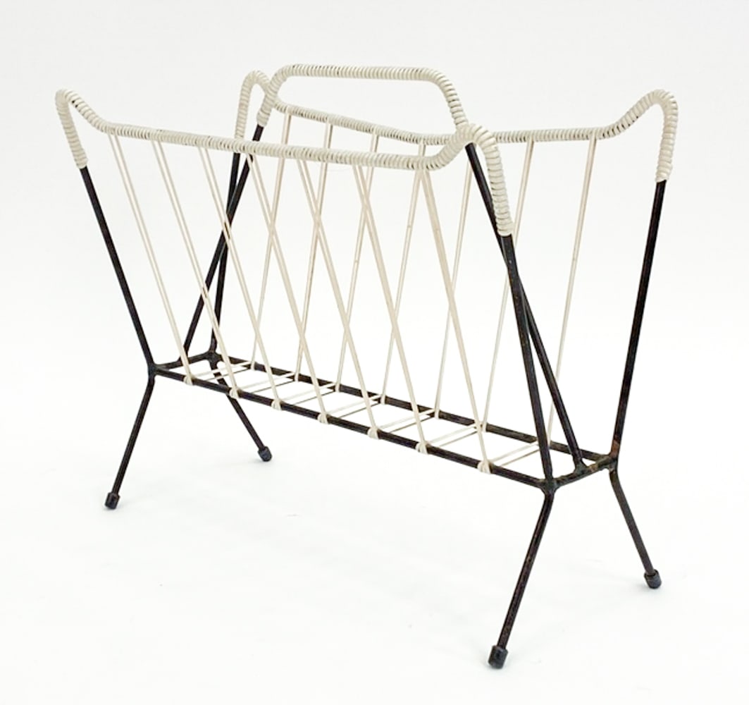 SWEDISH STEEL & CORD WRAPPED MAGAZINE RACK: Unmarked. Dimensions: H 13.5" x W 16.5" x D 8.5" Condition: Some marks to cord and oxidation to metal. D079