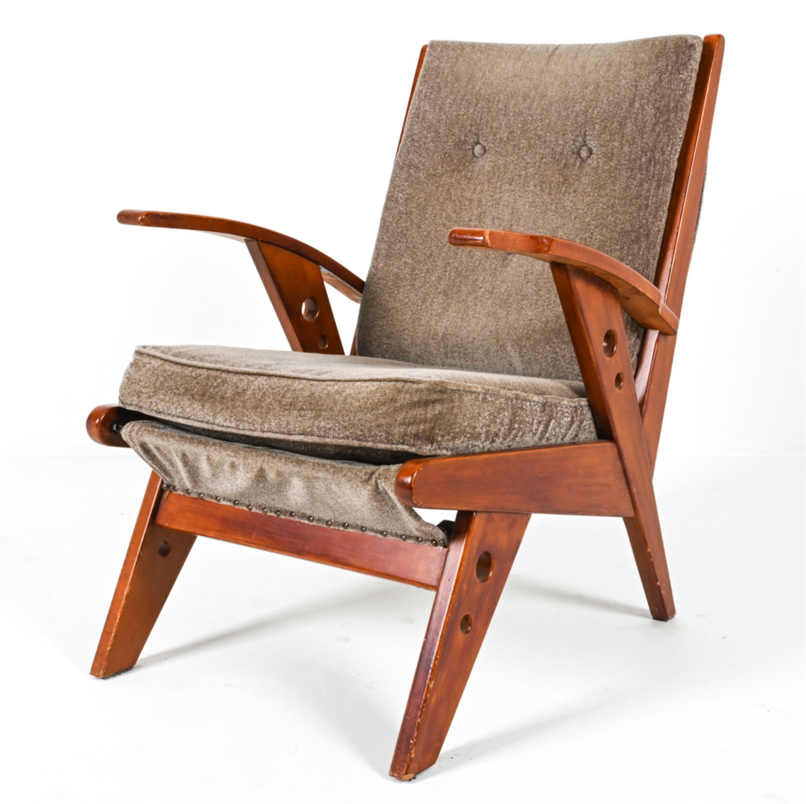 MID-CENTURY DUTCH OAK LOUNGE CHAIR C.1950'S: Grey fabric upholstery. Unique circular cut-outs on arms and legs. Dimensions: H 35.5" x W 25.25" x D 25.25" x SH 17.75". Condition: Some chips to finish on legs, arms. Wear consistent with age and us