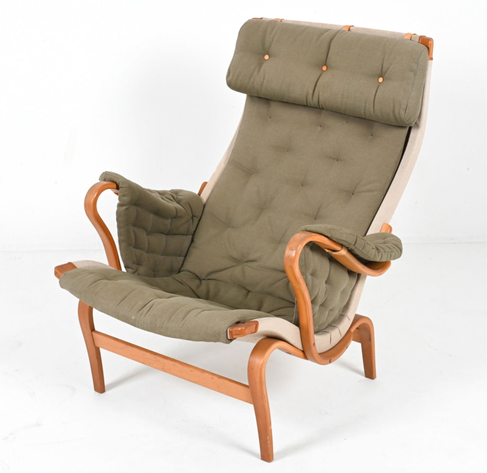 BEECH 'PERNILLA' CHAIR BY BRUNO MATHSSON: With fabric sling and cushions. For Dux. Swedish, circa 1970's. Dimensions: H 37.5" x W 34" x D 34" x SH 15.5". Condition: Some wear to leather straps on upholstery, cushion. Wear consistent with age