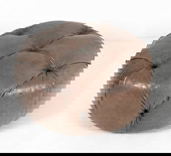 TUFTED LEATHERETTE OTTOMAN BY SALLY SIRKIN LEWIS: For J. Robert Scott & Associates. Contemporary. Dimensions: H 18 x Dia. 35". Condition: Minor spots of wear and discoloration.