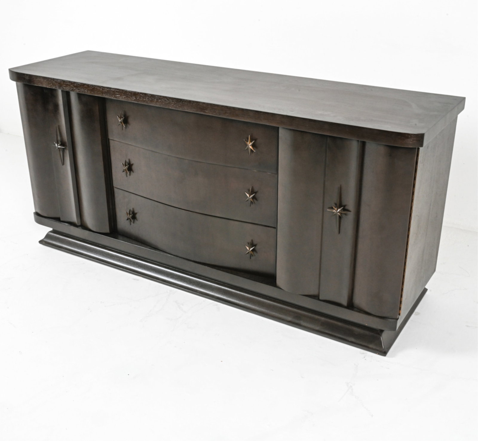 MID-CENTURY CREDENZA BY UNAGUSTA FURNITURE: Marked 'Forward Furniture by Unagusta' on inside of top drawer. Painted oak and mahogany with star-shaped bronze hardware. Circa 1950's. Dimensions: H 33.5" x W 72" x D 20.25". Condition: Minor scuffs
