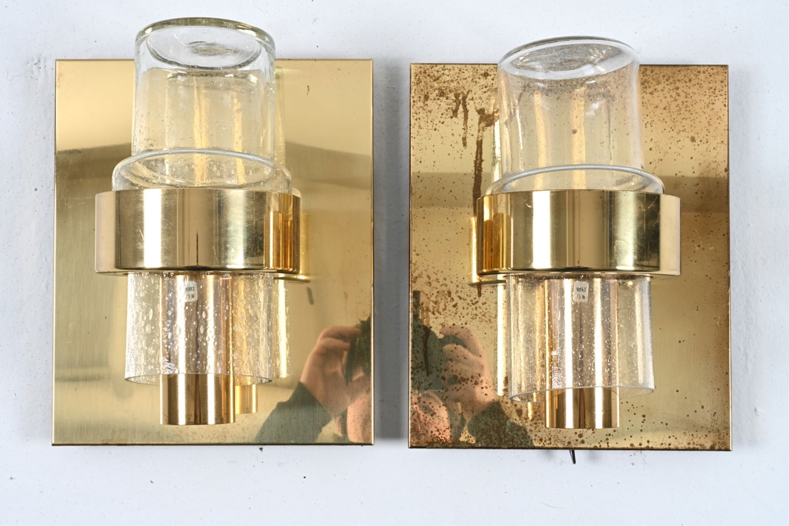 PAIR OF SCONCES; JONAS HILDE FOR HOVIK NORWAY: Brass and clear glass, with trapped bubble texture. Type 7360. Norway, c. 1970's. Dimensions: H 11.25" x W 9.5" x D 6" Condition: Wiring not tested. One chip and a few small nicks to glass. Brass with