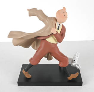 TINTIN REPORTER SCULPTURE BY LEBLON DELIENNE: Tintin reporter figure with Snowy. Resin. Produced by Herge. France, circa late 1980's or early 1990's. Dimensions: Tintin Figure H 13" x W 14" x D 9". Condition: In original packaging, excellent pres