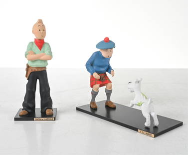 (2) TINTIN FIGURES BY LEBLON DELIENNE: Includes Tintin et Milou, 'Ile Noire' and 'Tintin en Amerique'. Cast resin. In original packaging with certificates of authenticity. Produced by Herge. France, late 1980's or early 1990s'. Dimensions: