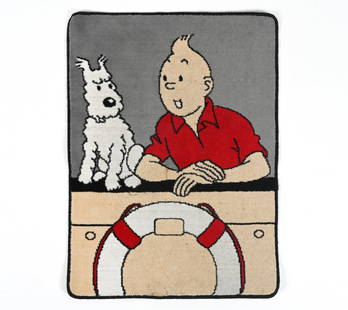 TINTIN RUG BY AXIS HERGE: Novelty Tintin rug featuring Tintin and Snowy. France, Early 1990's. Dimensions: H 39.5" x W 29". Condition: Surface soiling from regular use.