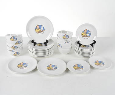 TINTIN AXIS HERGE CERAMIC GROUPING: Includes: Set of (12) bowls with Tintin and Snowy, (12) dinner plates and (12) small plates with same image. France, late 20th century. Dimensions: Larger plate Dia. 9". Smaller plates 7.5". Bowls H 3