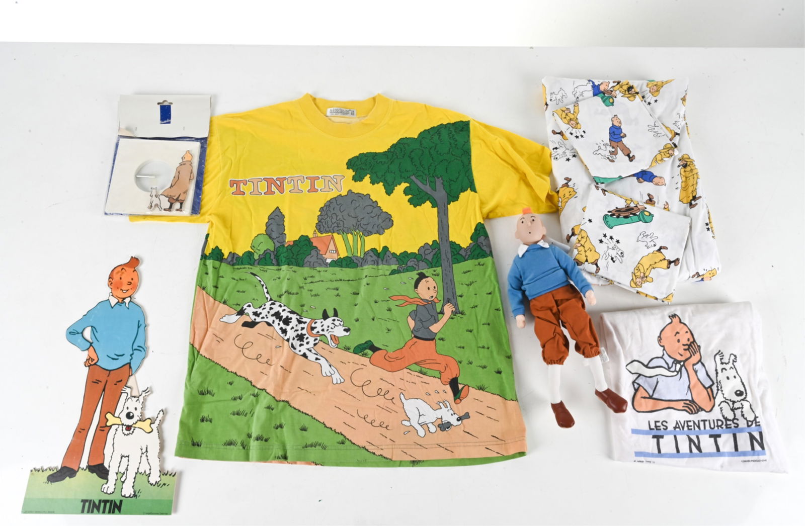TINTIN GROUPING SHEETS, SHIRTS, DOLL, ETC (1 of 15)