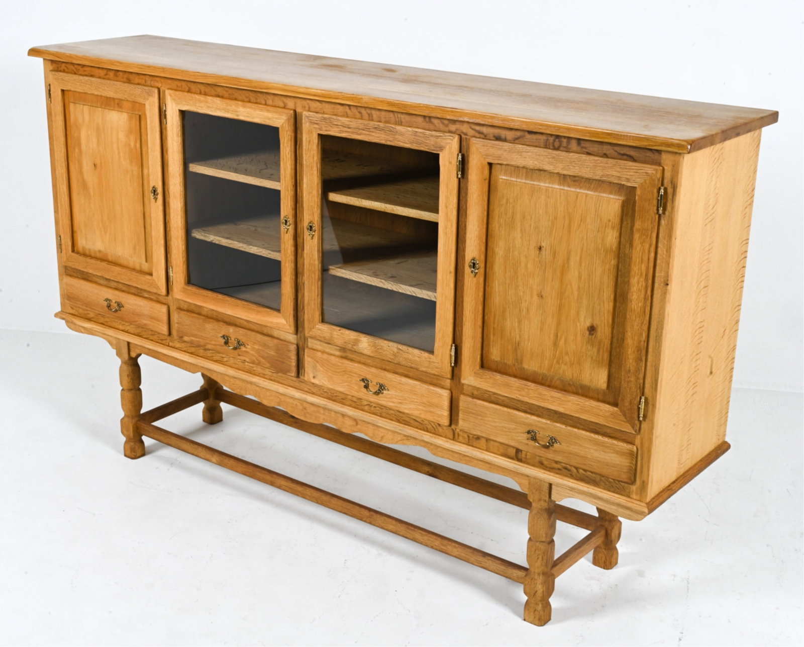 MANNER OF HENNING KJAERNULF OAK SIDEBOARD: Scandinavian, c. 1970's. Dimensions: H 47.75" x W 76" x D 18". Condition: Light wear consistent with age and use.
