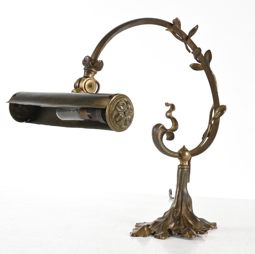 BRONZE ART NOUVEAU DESK LAMP: Decorative desk or piano lamp with botanical form. Early 20th century. Dimensions: H 13" x W 12.5" x D 9.5". Condition: Minor surface soiling. Wiring untested, European plug - requires adapter or rewi