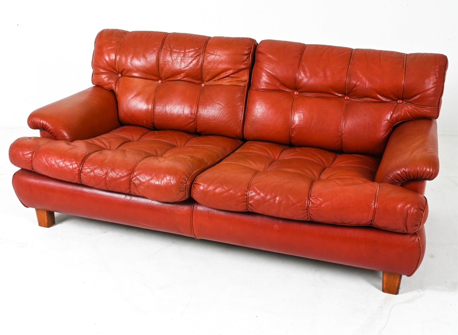 LEATHER SOFA BY ARNE NORELL C.1960'S: Dimensions: H 26.25" x W 67" x D 36" x SH 15.25". Condition: Spots of wear to leather on back, some thin scratches. Wear consistent with age and use. PG116