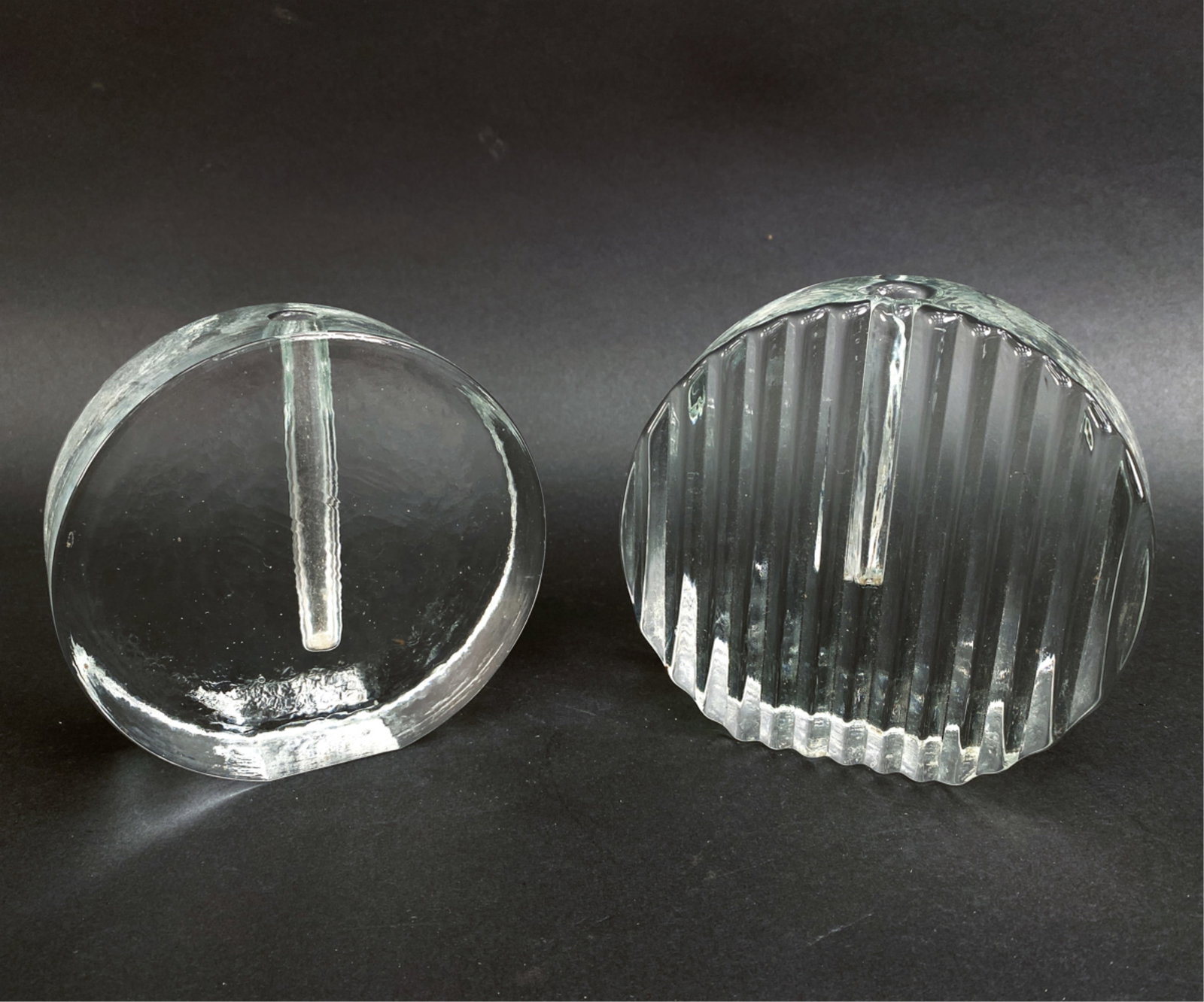 (2) MODERNIST GLASS BUD VASES: (2) Vintage bud vases in the manner of Klaus Breit for Wiesenthalhutte or Frederick W. Walther, Germany c. 1970s. Both unsigned. Remnants of a sticker on the larger. Dimensions: (Larger) H 5.25" x W 5