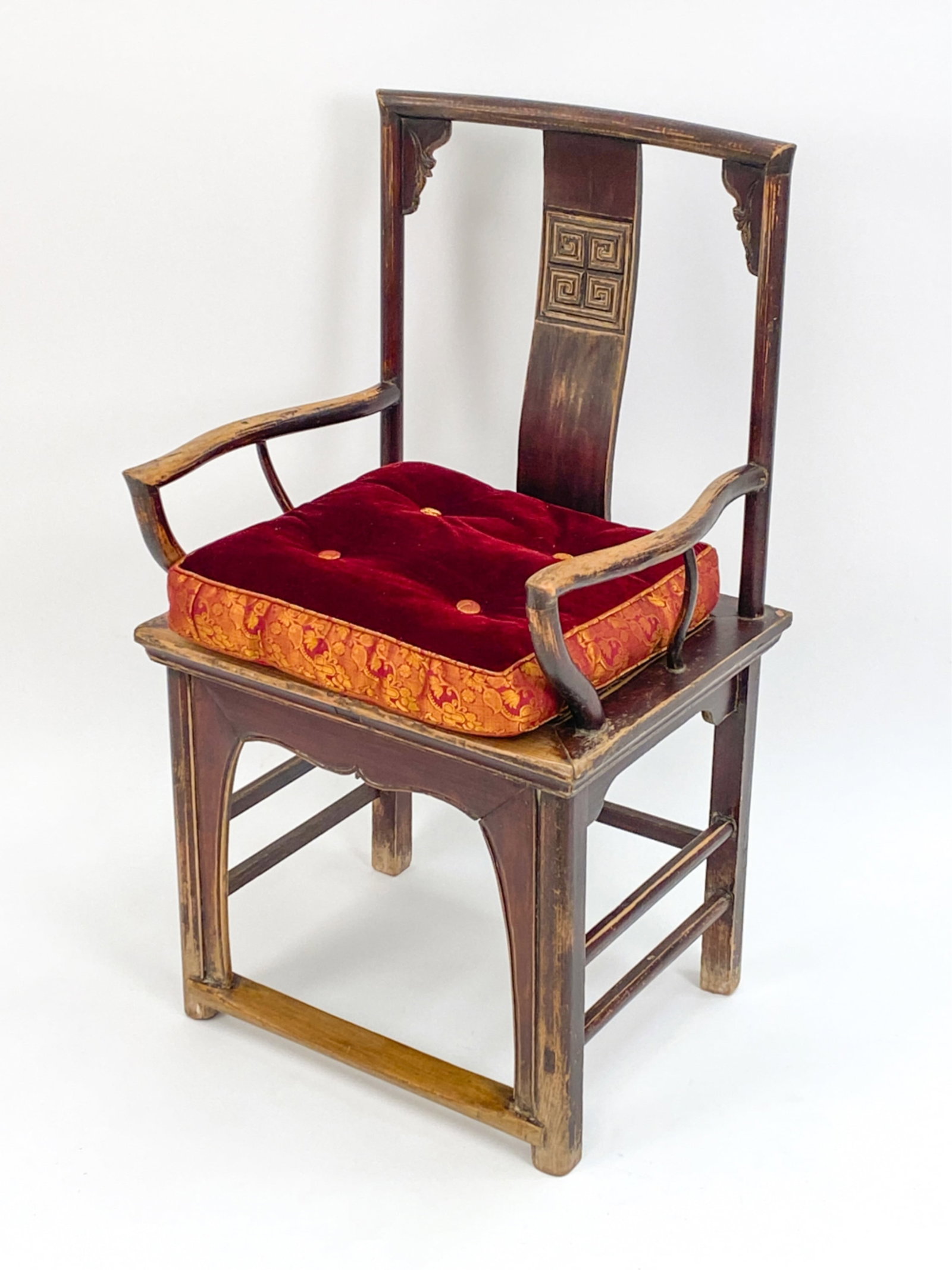ANTIQUE CHING DYNASTY CHINESE CHAIR: Hardwood with shaped arms, subtle carved elements to back. Originally stained. Wax export seal. With modern contemporary cushion. Dimensions: H 42" x W 24" x D 20" x SH 20.5" Condition: Reddish brown 