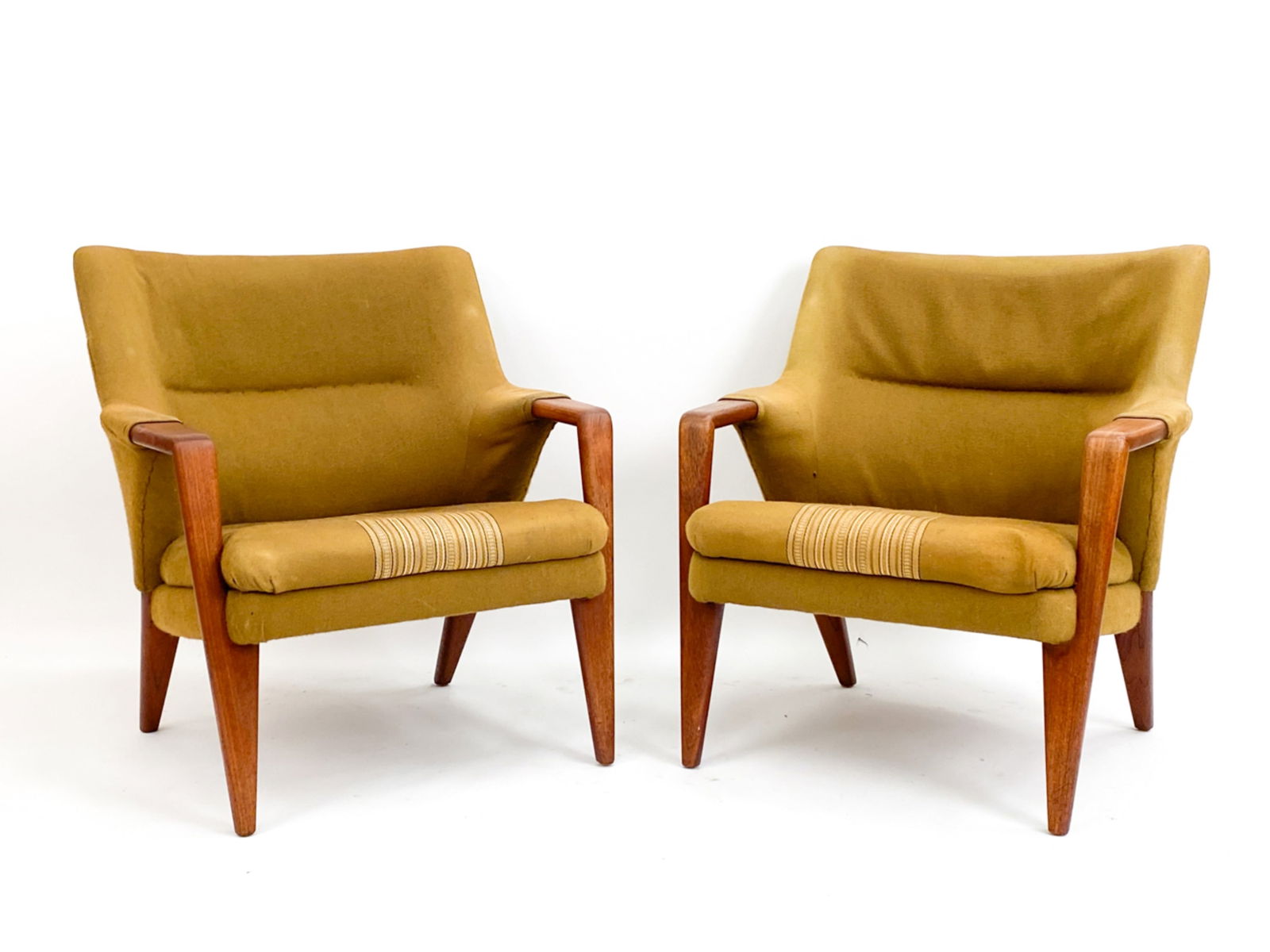 DANISH MID-CENTURY KURT OLSEN LOUNGE CHAIRS C.1950: Pair of Vintage Danish Modern Kurt Olsen lounge chairs. Manufactured by Slagelse Mobelvaerk circa 1950. Teak frame, wool upholstery. Marked Made in Denmark under. Dimensions: H 30" x W 28" x D 31.5" x