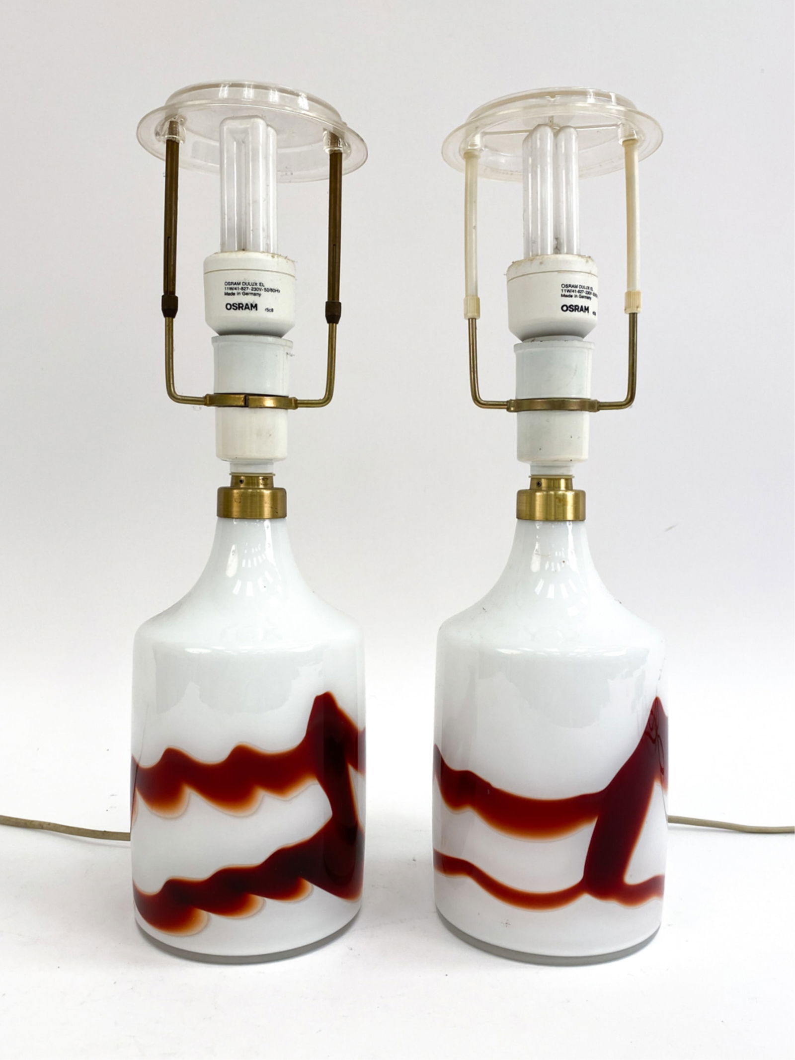 PAIR OF HOLMEGAARD GLASS TABLE LAMPS: Both with Holmegaard labels underneath. No shades included. Dimensions: H 16" x Dia 4.25" Condition: No issues to note, some surface dust. European plugs