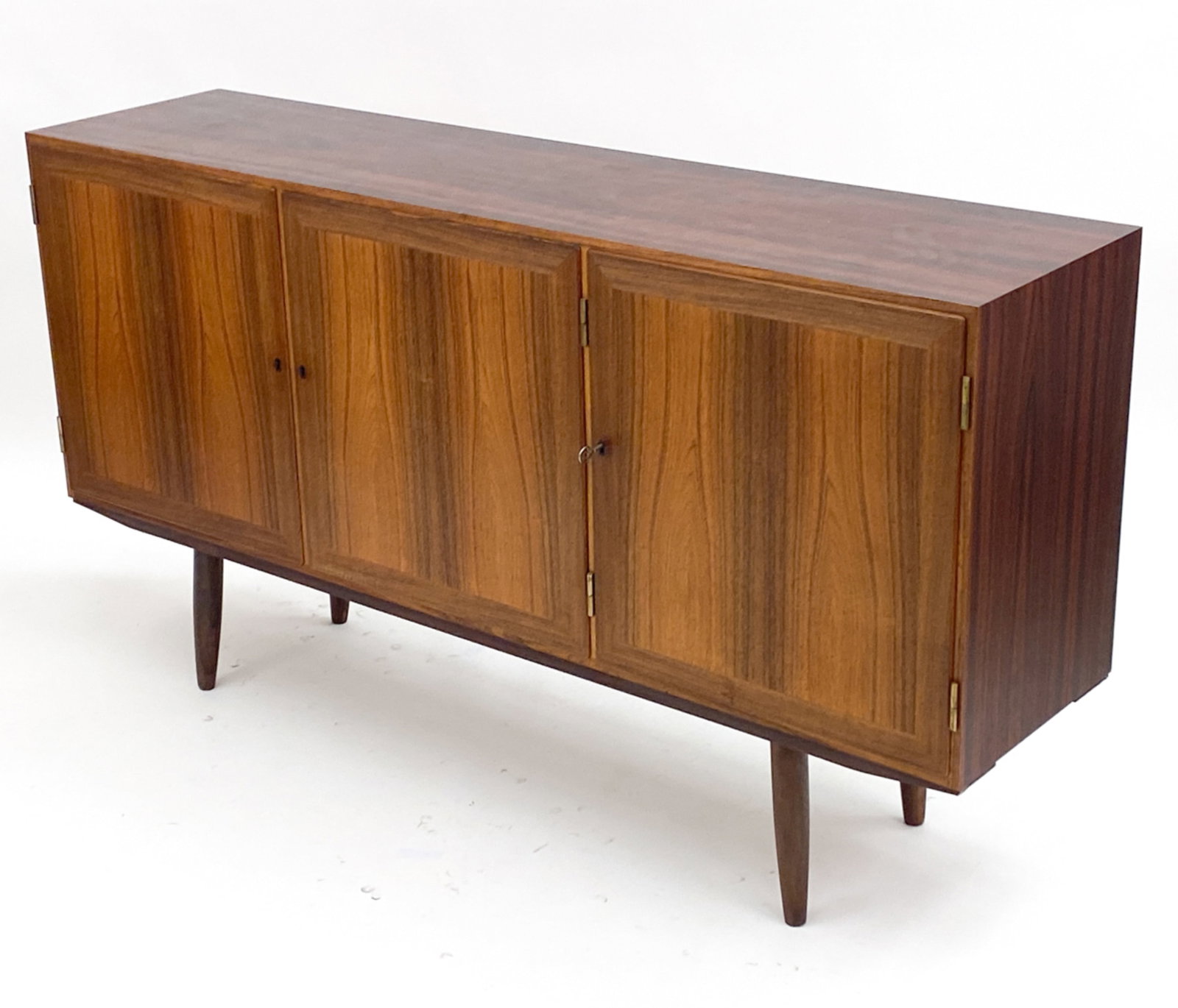 DANISH ROSEWOOD SIDEBOARD BY KAI WINDING: Danish control stamp on back panel. Key included. Circa 1960's. Dimensions: H 35" x W 64.75" x D 15.75" Condition: Finish wear consistent with age and use, mainly to top. E301