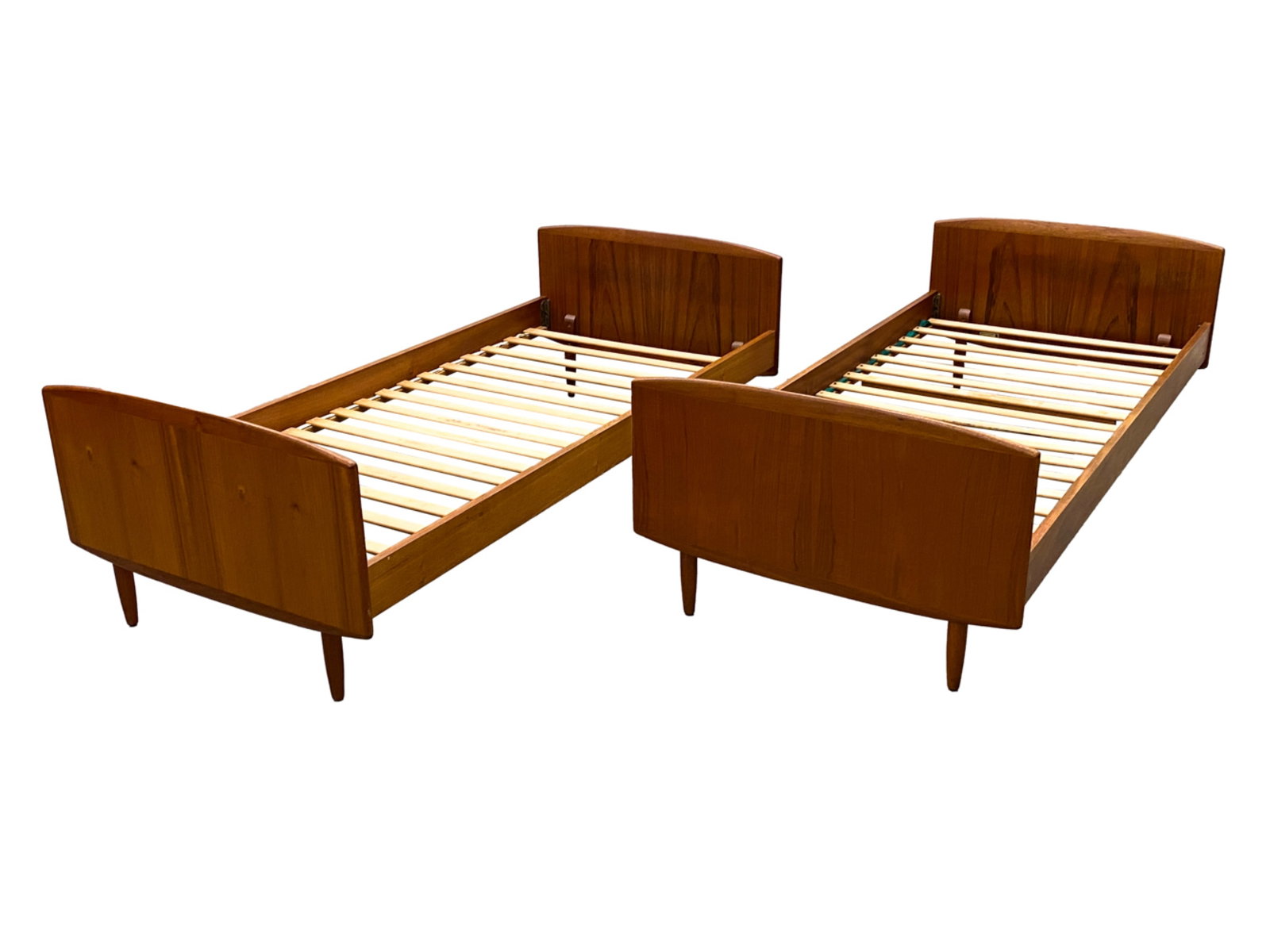 PAIR OF DANISH MID-CENTURY TEAK DAYBEDS, C. 1960'S: No mattresses included. One signed on headboard, Melvin Mikkelsenmobler. Dimensions: H 24.25" x W 76.25" x D 36" Condition: Slats with wear including a few chips/losses and one with a repair. Finish w