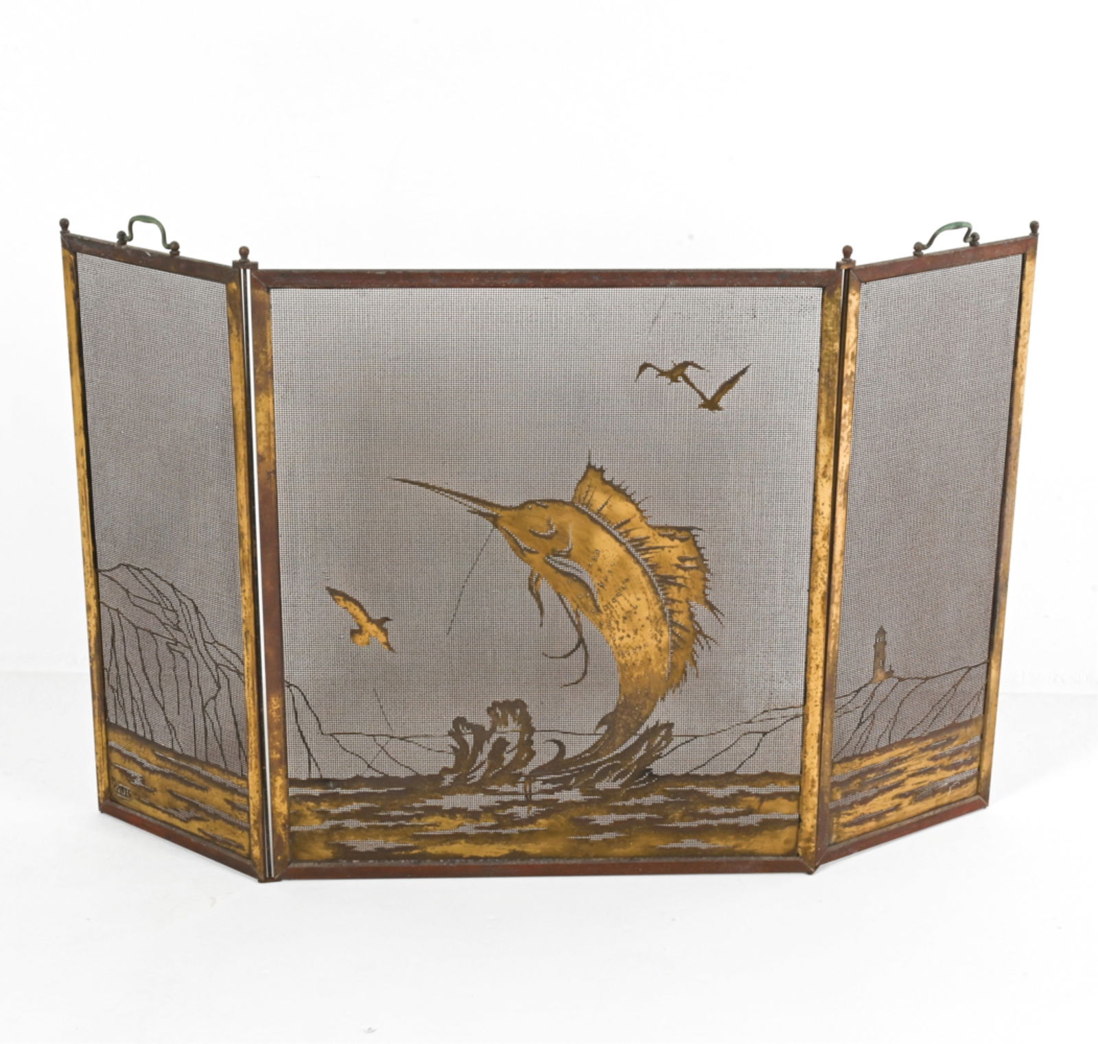 BRASS FIREPLACE SCREEN WITH SWORDFISH: Possible signature in bottom right corner. Mid 20th century. Dimensions: H 30.75" x W 50.25". Condition: Signs of tarnish and surface soiling, consistent with age and use.