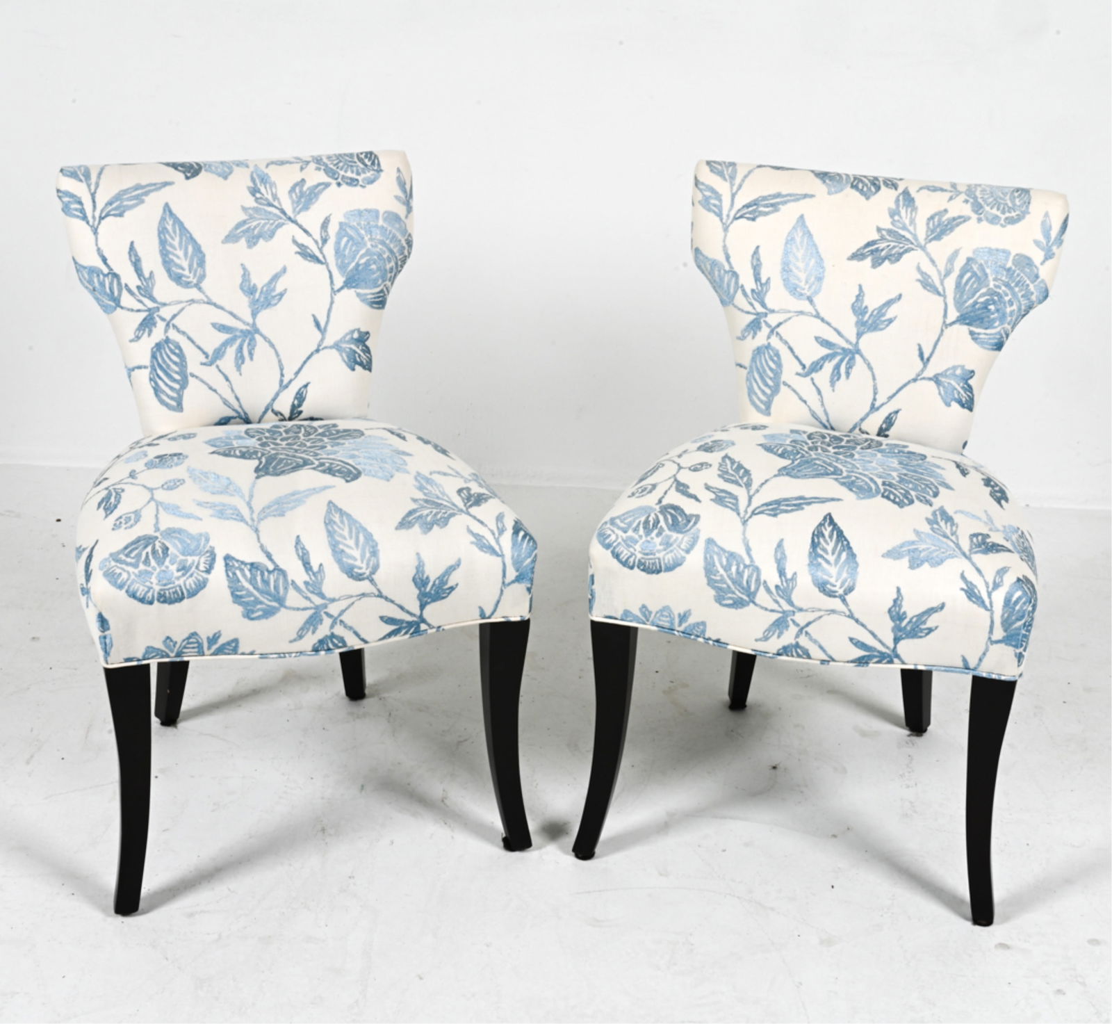 (2) BLUE FLORAL EMBROIDERED SIDE CHAIRS: Floral fabric upholstery. Contemporary. Dimensions: H 33" x W 22" x D 19" x SH 21". Condition: Wear consistent with age and light use.