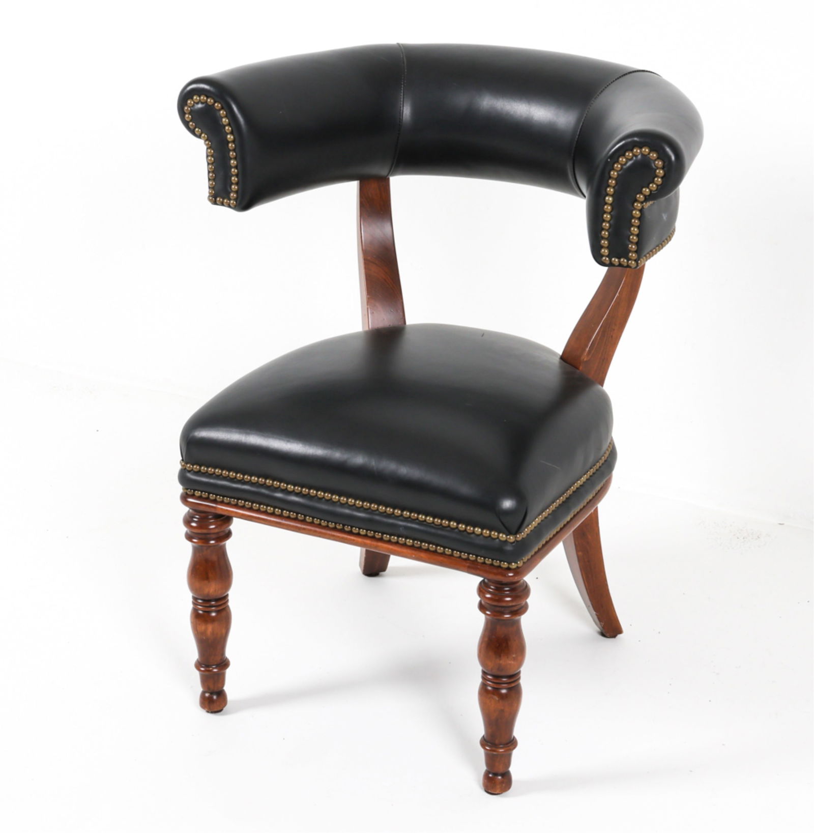 MAHOGANY ARMCHAIR BY WILLIAM SWITZER: Black vinyl upholstery with brass tacks accents. Canada, contemporary. Dimensions: H 35" x W 25" x SH 21" x SH 20". Condition: Minor surface soiling, some scuffs and dings to wood, upholstery.