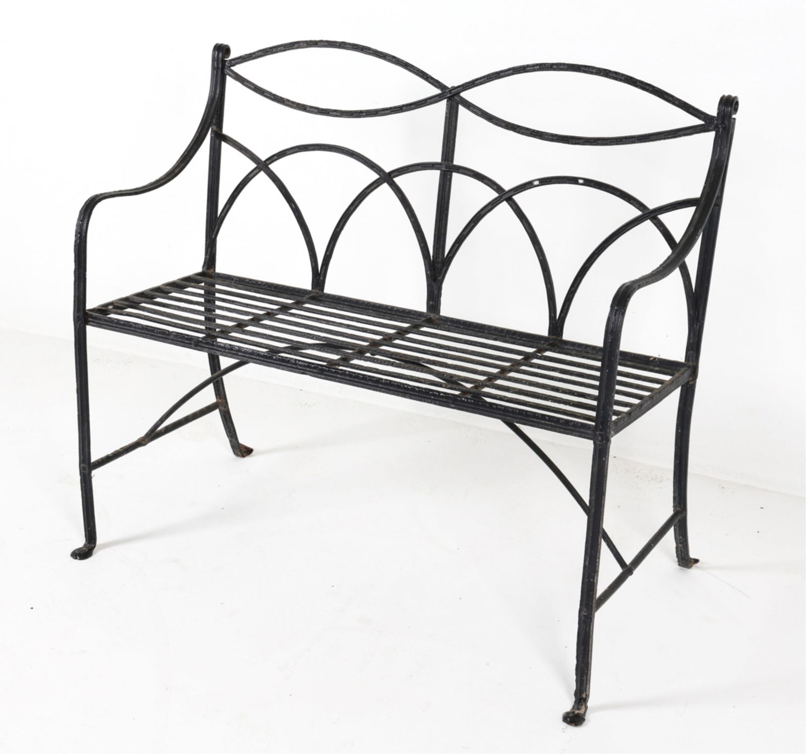 WROUGHT IRON OUTDOOR BENCH: Late 20th century. Dimensions: H 37" x W 44" x D 23" x SH 19". Condition: Some signs of wear and surface soiling, consistent with outdoor use.