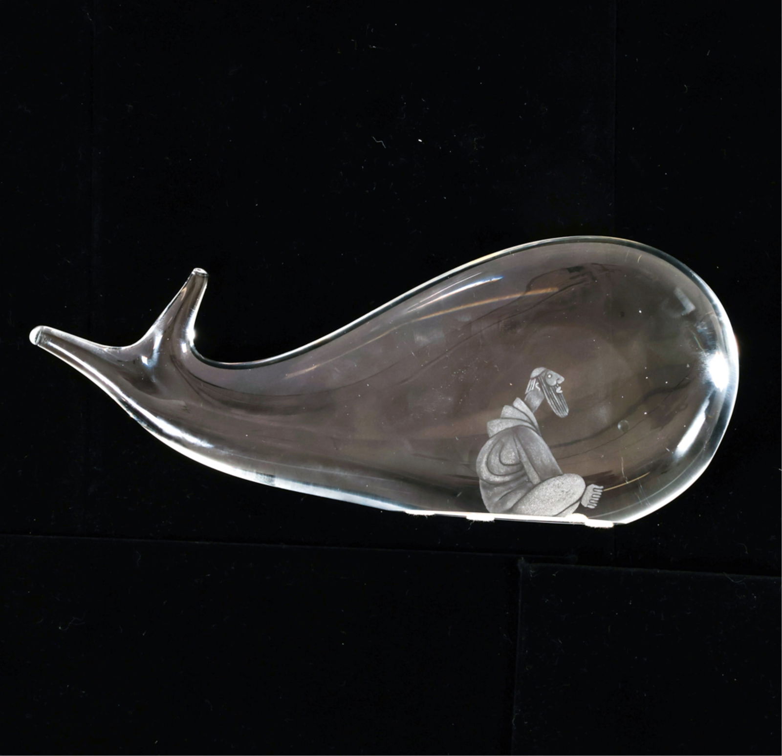 VICKE LINDSTRAND FOR KOSTA BODA ART GLASS WHALE: For Kosta Boda. Hand-blown glass with frosted design depicting Jonah and the Whale. Signed underneath by the artist. Dimensions: H 4" x W 10.25". Condition: Minor thin surface scratches, small scuff o