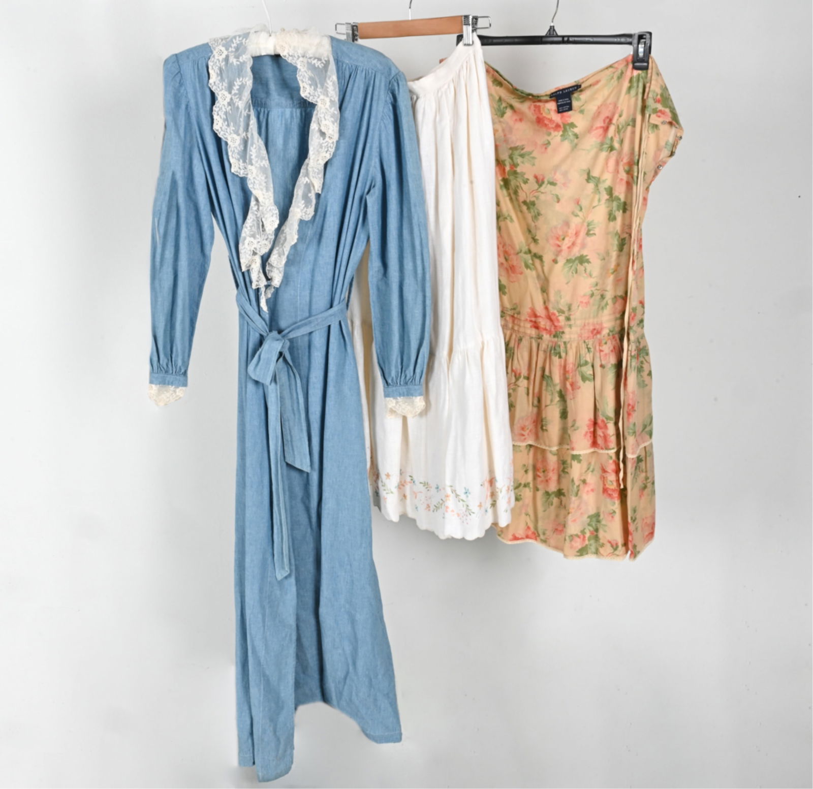 VINTAGE RALPH LAUREN DRESS & SKIRTS: Grouping of iconic vintage Ralph Lauren clothing in the Western/Prairie style, including: chambray wrap dress with lace trim, size M; linen maxi skirt with painted flowers, size 10; and floral cotton