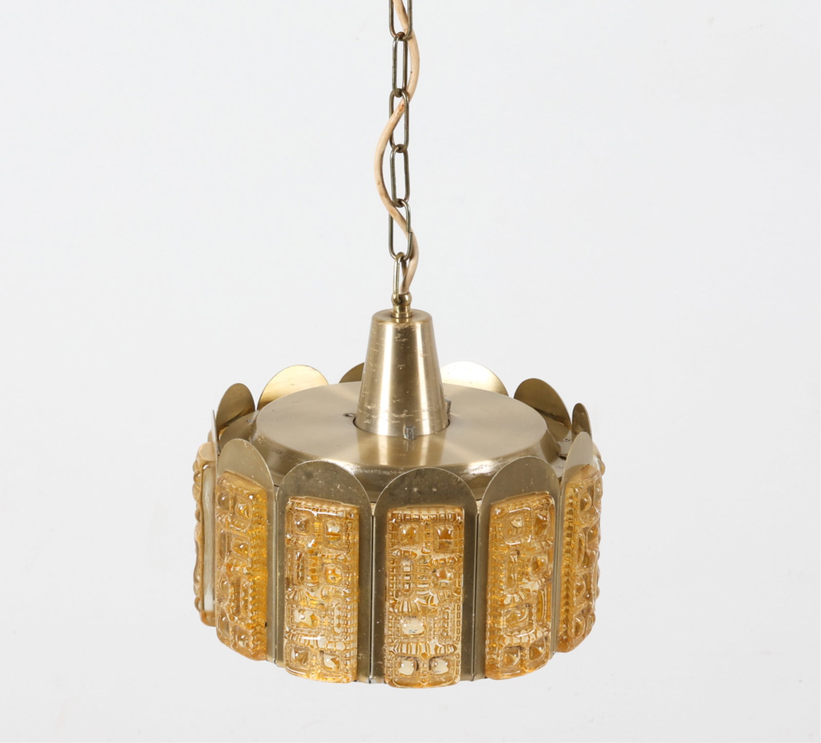 BRASS AND GLASS CHANDELIER FOR VITRIKA: Brass panels with amber glass inserts. Danish, circa 1960's. Dimensions: H 8.5" x Dia. 9.25". Condition: Scuffs to aluminum on top. Wear consistent with age and use. DMH148