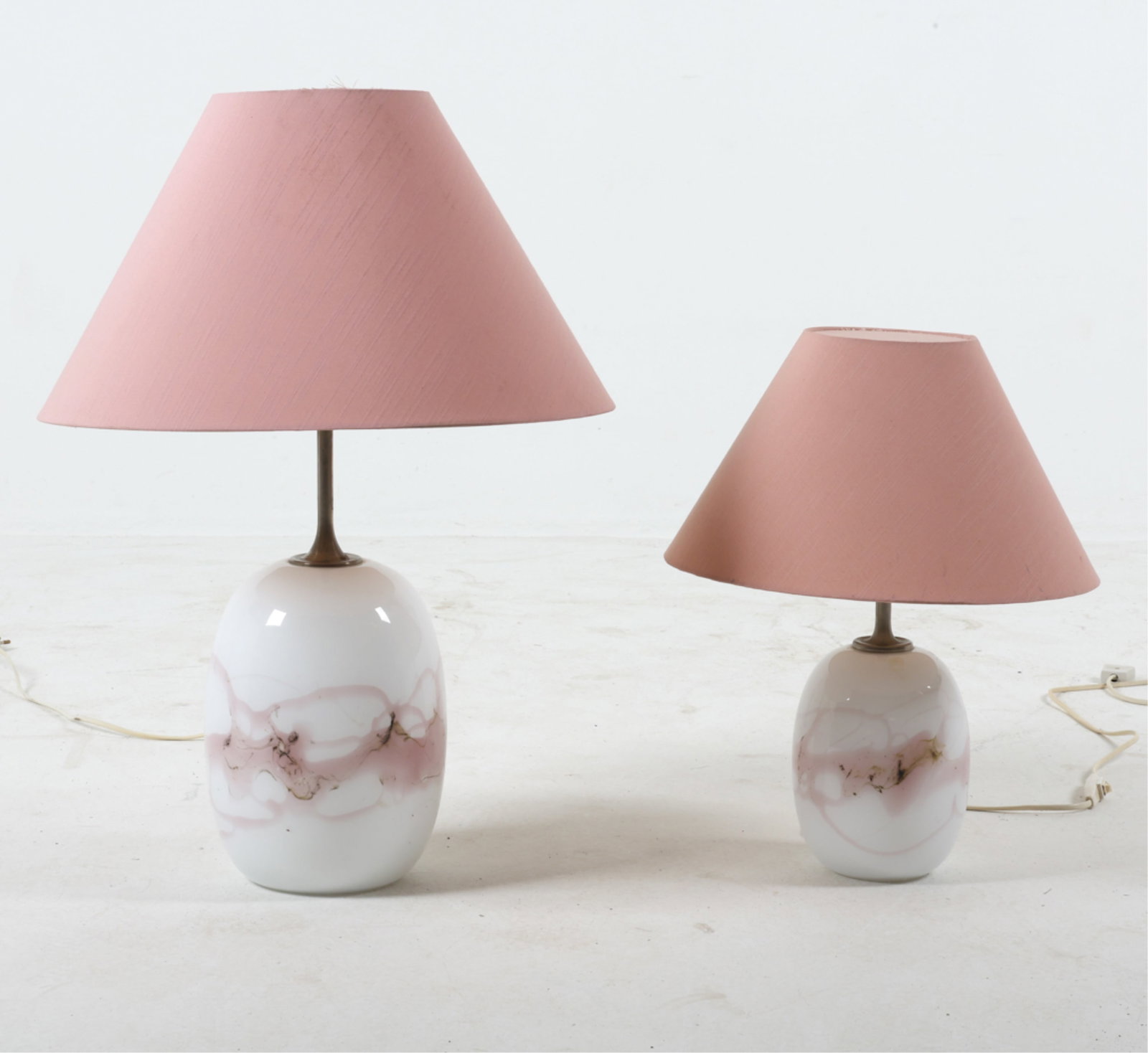 (2) 'SAKURA' TABLE LAMPS BY MICHAEL BANG: For Holmegaard. Handblown glass with pink and brown accents. Pink fabric shades. Danish, circa 1980's. Dimensions: Largest H 25.5" x Dia. 18.25". Smallest H 17.75" x Dia. 14". Condition: Wiring untest