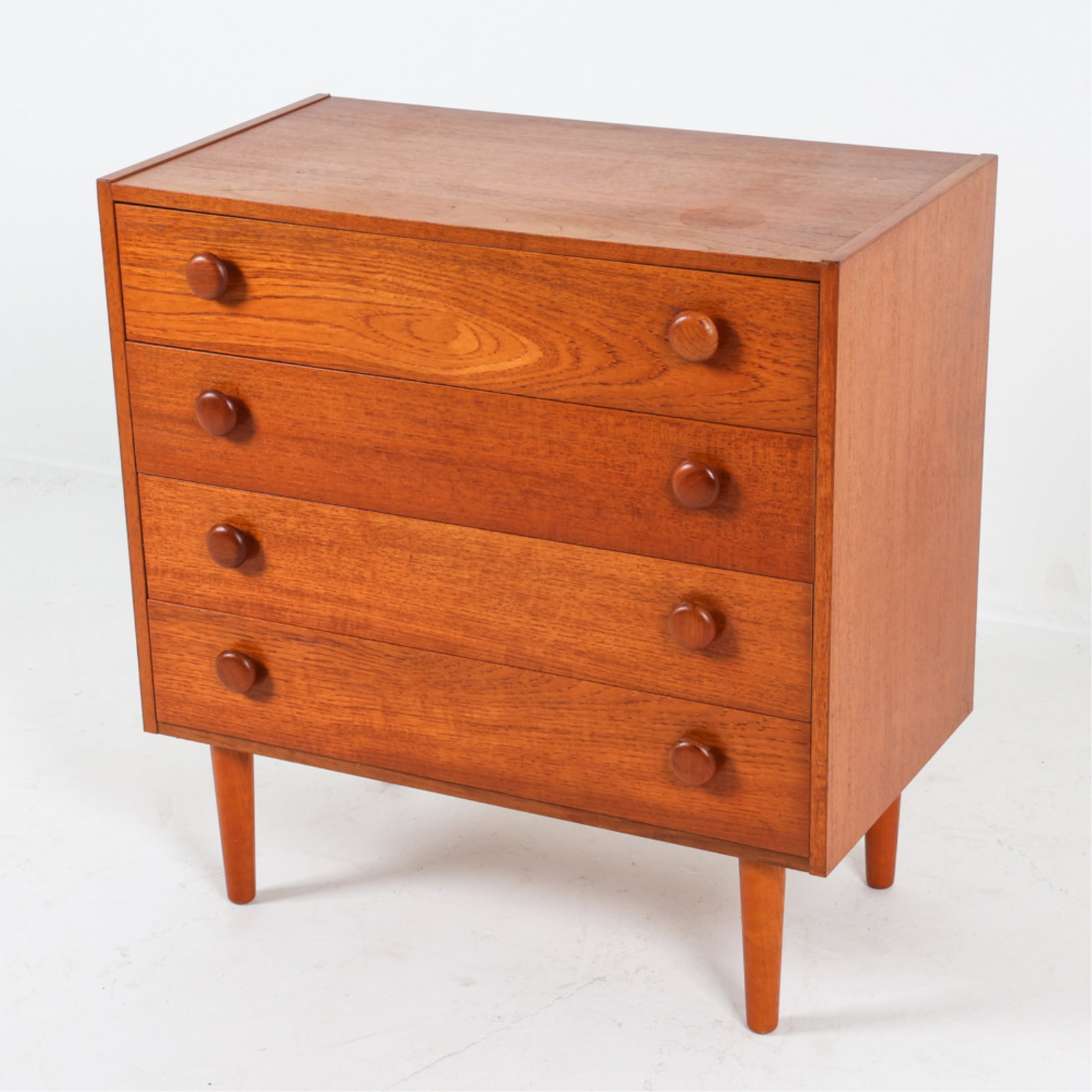 DANISH TEAK CHEST OF DRAWERS, C.1970'S: Rounded drawer pulls Tapered legs. Dimensions: H 30.75" x W 29.75" x D 15.75". Condition: Some water rings on to. Nicks and scuffs. Wear consistent with age and use. DMH118B