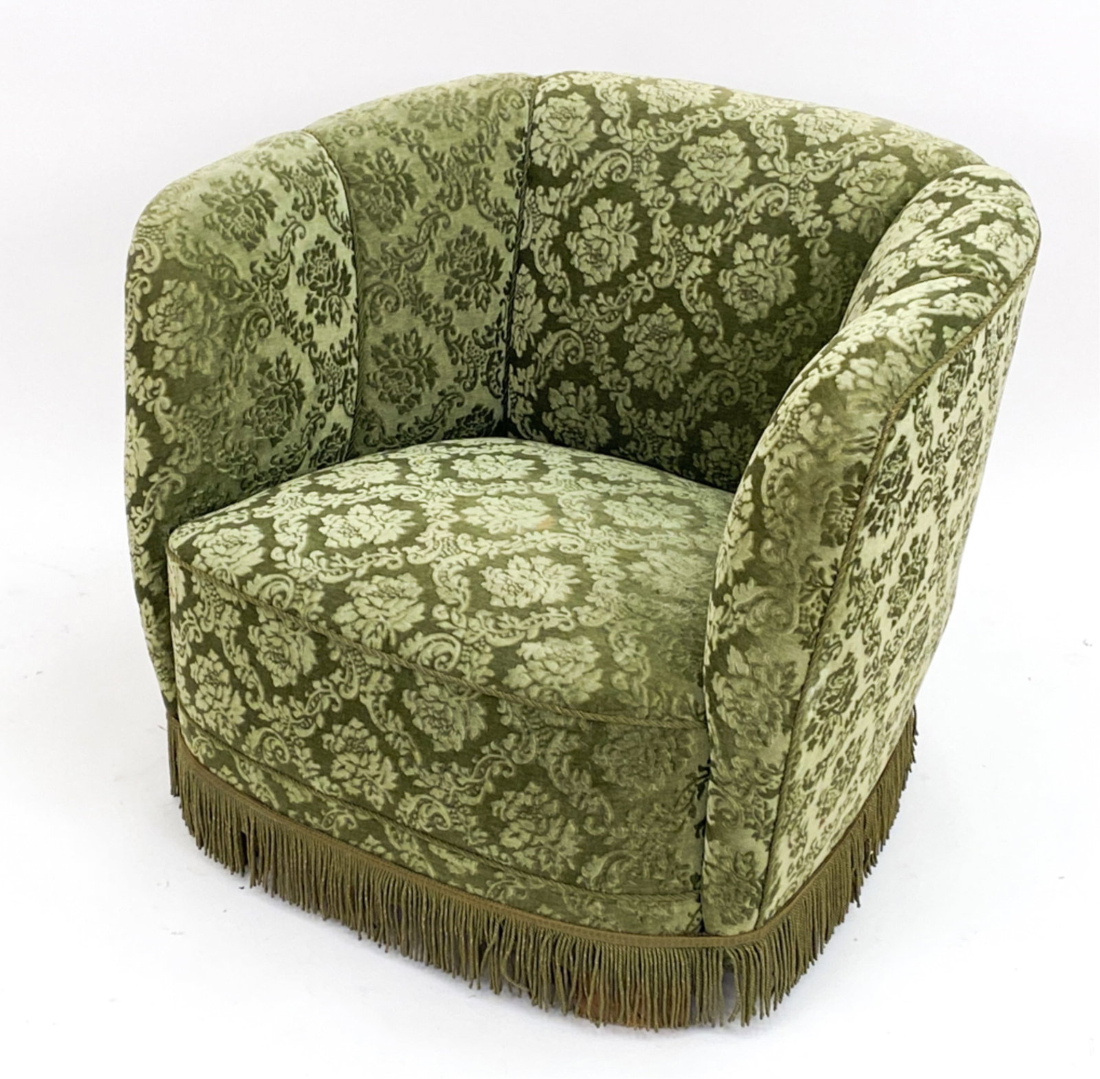 VIGGO BOESEN STYLE DANISH CLUB CHAIR, C.1950'S: Danish Viggo Boesen style . Green floral upholstery. Tassel edges. C ,1950 Dimensions: H 26" x W 33" x D 26' Condition: wear includes fading to upholstery. Consistent with age and use. PH021