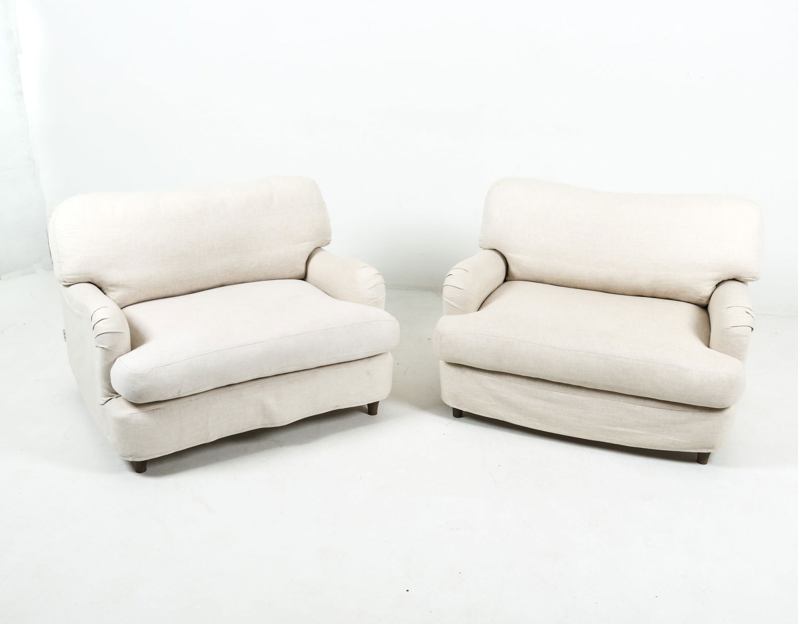 OVERSIZED LOUNGE LOUNGE CHAIRS FROM LOAF: Model named 'Jonesy'. Custom linen covers over fabric upholstery. Very plush. English, contemporary. Dimensions: H 30.5" x W 42" x D 34.25" x SH 16.5". Condition: Some faint marks of discoloration, pi
