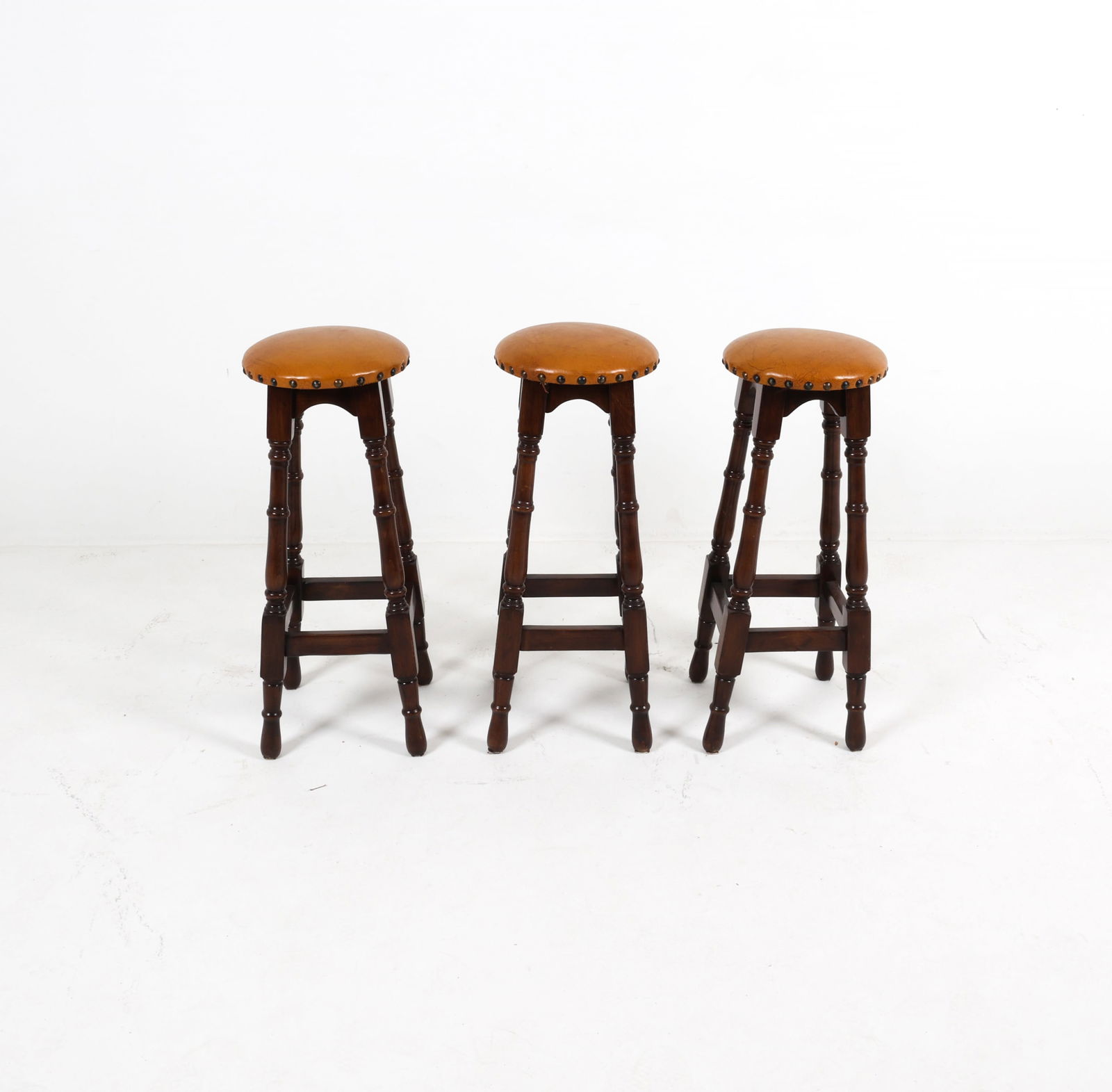(3) VINTAGE BRASS TACKED BAR STOOLS (1 of 14)