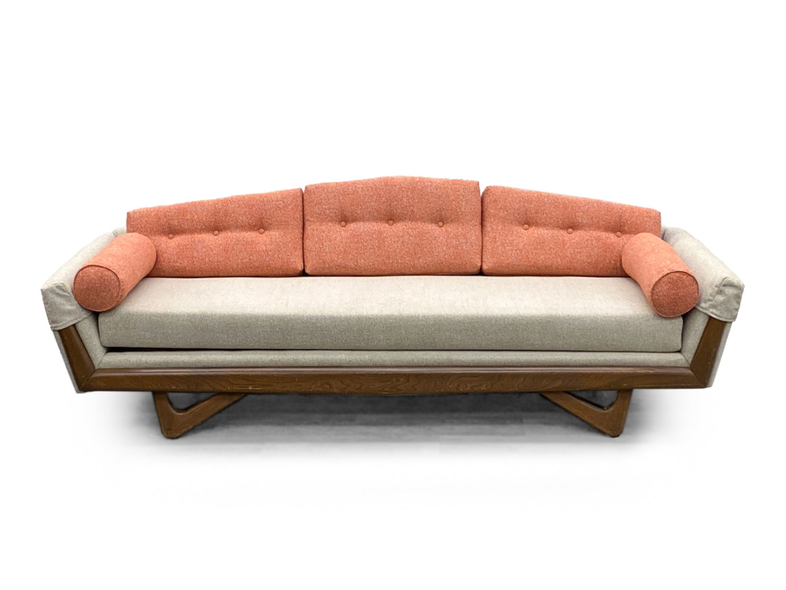 GONDOLA SOFA, STYLE OF ADRIAN PERSALL: Unsigned Woven Upholstered Sofa with 5 red upholstered pillows. In the manner of Adrian Persall Dimensions: H 26" x W 91" x D 33" Seat height 16" Condition: Marks and dings to wooden legs and frame.