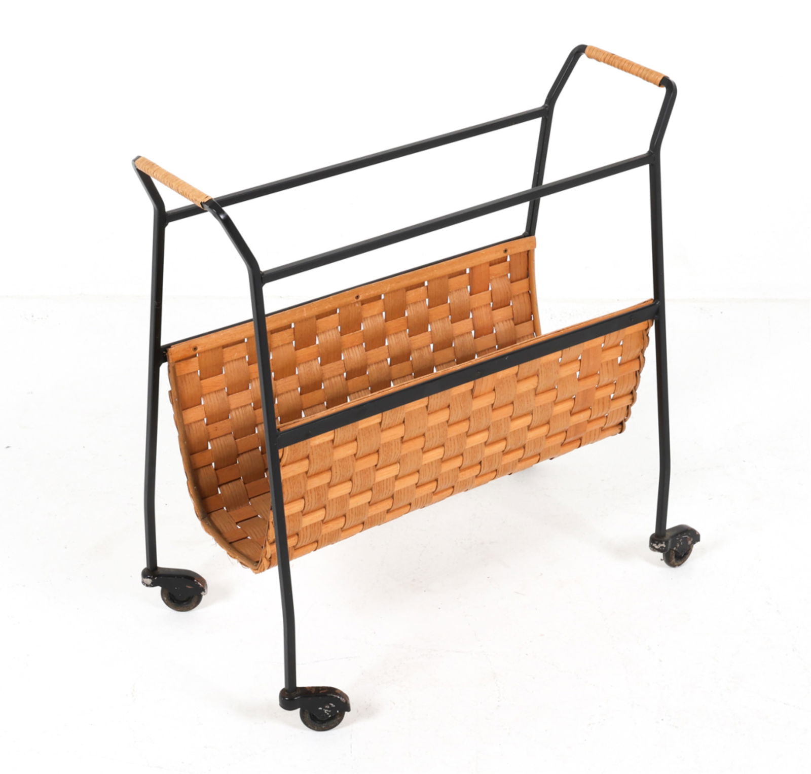 DUTCH IRON AND CANE MAGAZINE CART: Circa 1960's. Dimensions: H 24" x W 21.5" x D 12.5". Condition: Some scuffs to cane, small scuffs and dings to finish on metal. Wear consistent with age and use. PI178