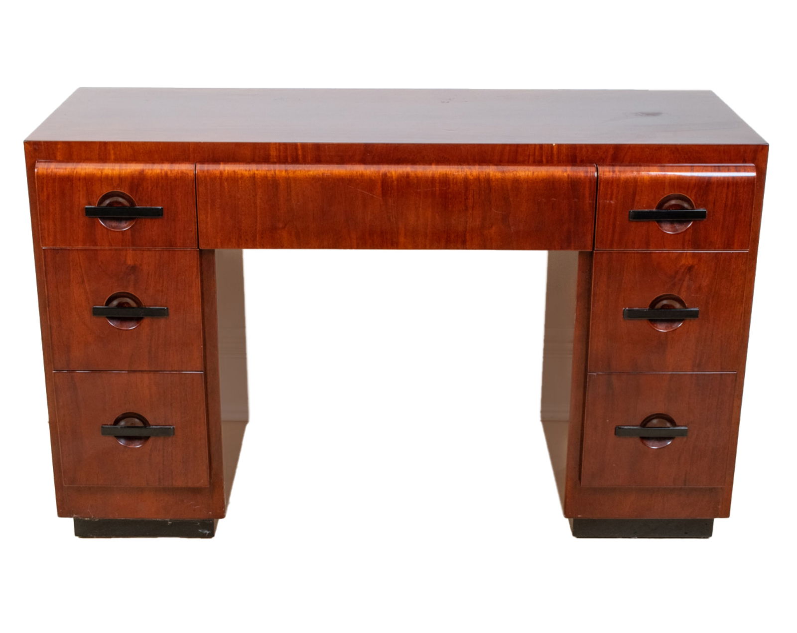 J.B. VAN SCIVER CO. ART DECO DESK: J. B. Van Sciver Co. Art Deco writers desk. Made in Camden, NJ. Featuring center draw with three draws on each side. Label in center draw. Dimensions: H 29.5" x W 48" x D 18" Condition: Very minor sur