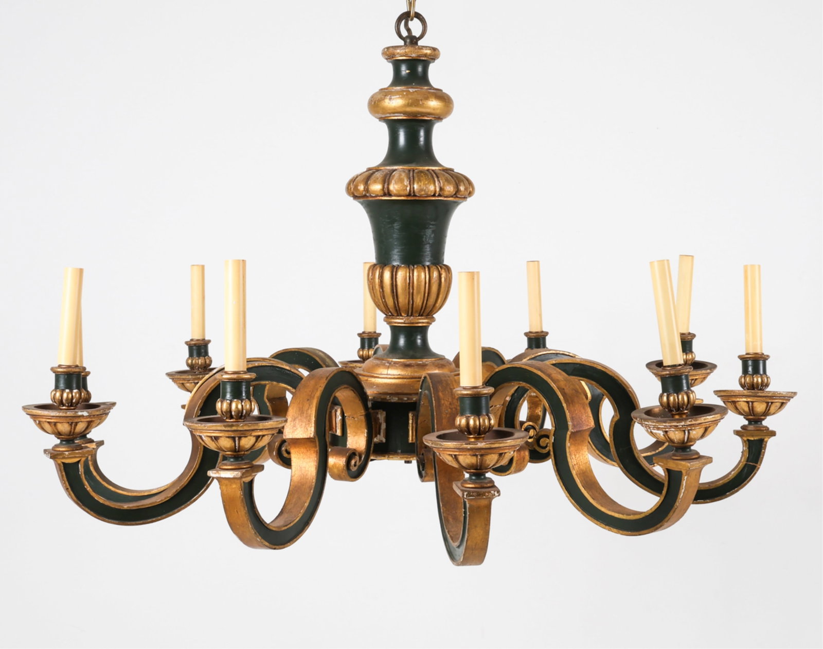 CARVED, PAINTED, & GILT WOOD CHANDELIER: Neoclassical style with urn-form center piece. Candle-form lights. Early 20th century. Dimensions: H 28" x Dia. 46.25". Condition: Minor losses to painted finish. Some damage to arms, former repairs. 