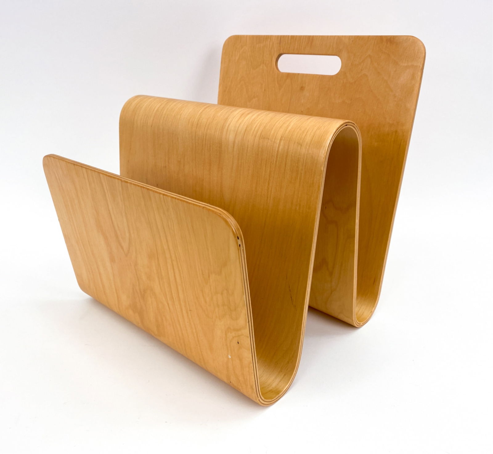 BENTWOOD MAPLE MAGAZINE RACK: Maple wave shape bentwood magazine rack. unsigned. Dimensions: H 14" x W 13" x D 12" Condition: wear includes, marks, scattered scratches and dings to wood.