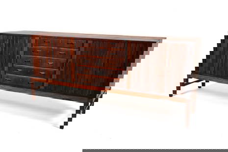 ROSEWOOD SIDEBOARD IN THE MANNER OF OLE WANSCHER: Luxuriate in the perfect symmetry of this exceptional Danish Modern sideboard, modeled after Ole Wanscher's timeless design for A. J. Iversen. This piece marries functionality and quiet beauty in a qu