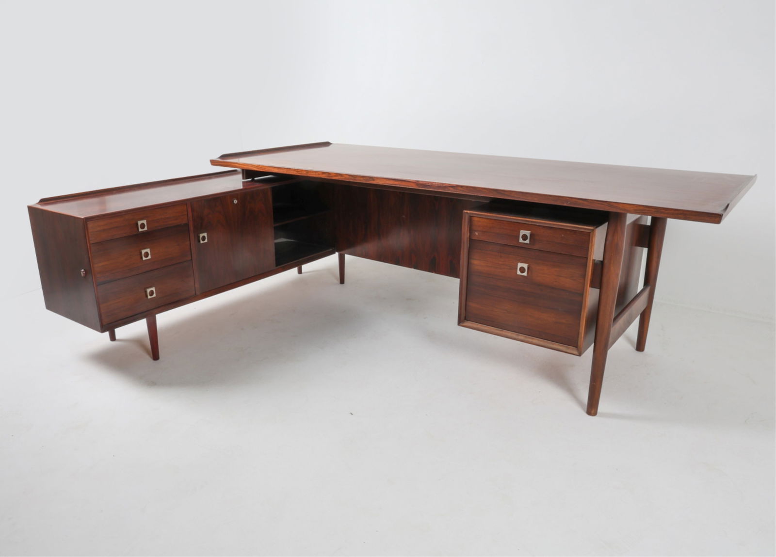DANISH ROSEWOOD EXECUTIVE DESK BY ARNE VODDER: For Sibast. Model 208. Desktop sits on top of sideboard piece, rests on rubber feet. Steel drawer and cabinet door pulls. Adjustable shelves. Circa 1960's. Dimensions: Desk Piece H 30" x W 80" x D 35.
