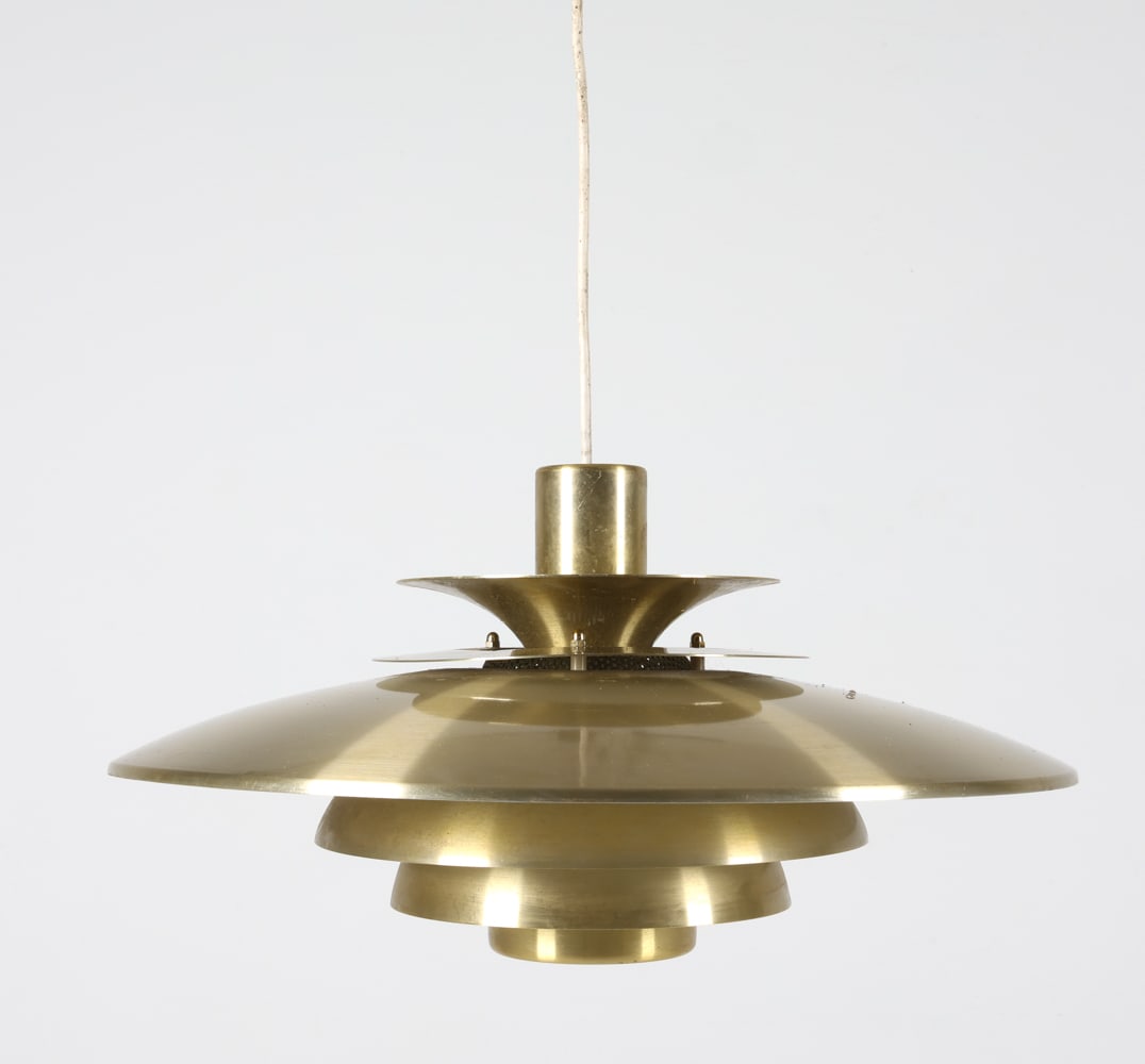 'VERONIA' BRASS PENDANT LIGHT BY KURT WIBORG: For Jeka Metaltryk. Denmark, Circa 1970's. Dimensions: H 10.25" x Dia. 18.5". Condition: Wiring untested, cords cut may require rewiring. Minor scuffs and dings to brass finish. Wear consistent with a