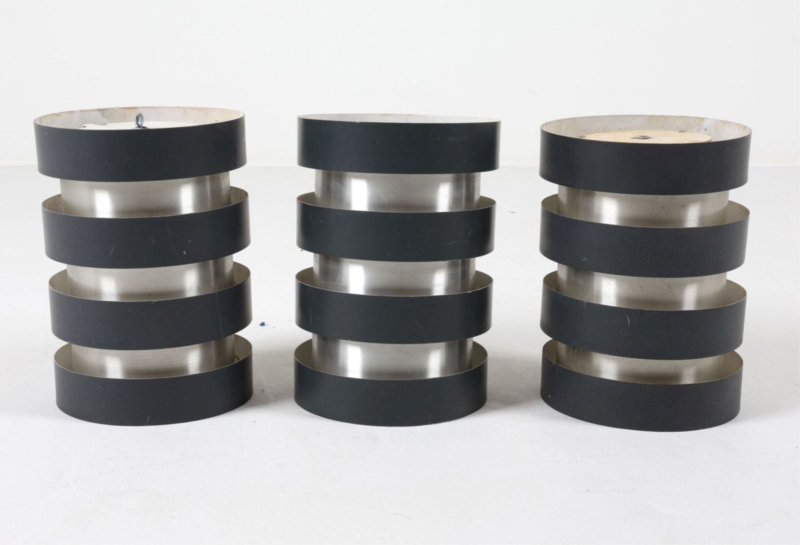 (3) 'EIFFEL' PENDANT LIGHTS BY JO HAMMERBORG: For Fog & Morup. Brushed aluminum with painted bands. Circa 1960's. Dimensions: H 9.75" x Dia. 7". Condition: Wiring untested, cords cut and require rewiring. Minor surface soiling, some scuffs and di