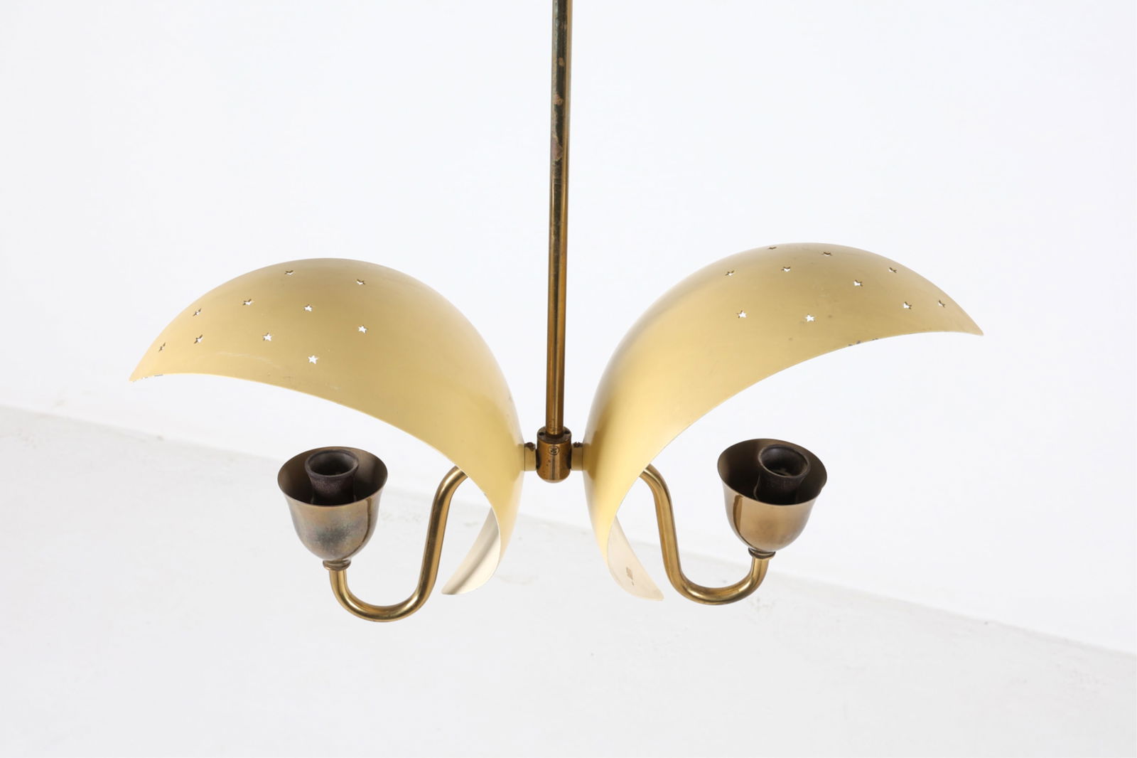 BRASS 'STAR' CHANDELIER BY BENT KARLBY: For Fog & Morup. Brushed aluminum shades with perforated star cut-outs. Denmark, circa 1960's. Dimensions: H 25" x W 18.5" x D 5". Condition: Wiring untested, may require rewiring. Minor surface soili