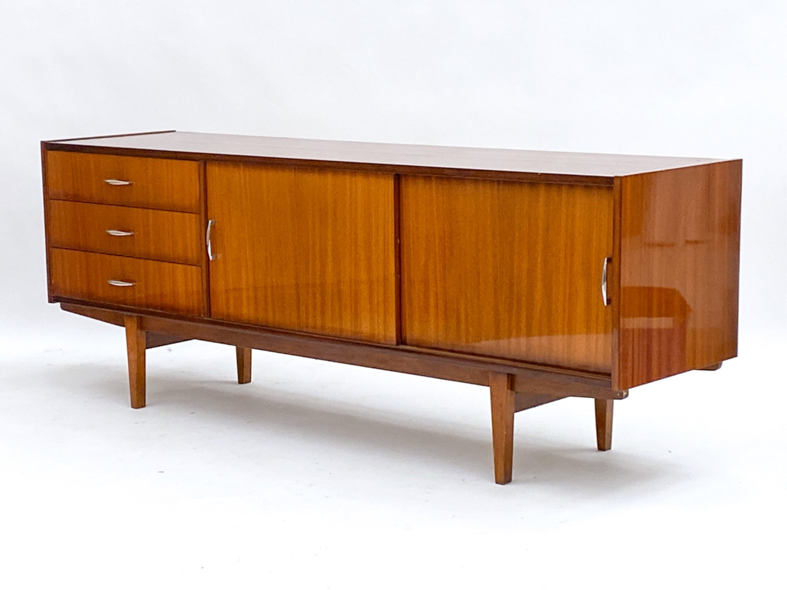 POLISH MID-CENTURY MAHOGANY SIDEBOARD: Sideboard w/ drawers and sliding cabinet doors Dimensions: H 26.5" x W 71.5" x D 17.75" Condition: Drawers stick. Minor marks and surface scratches, consistent with age and use