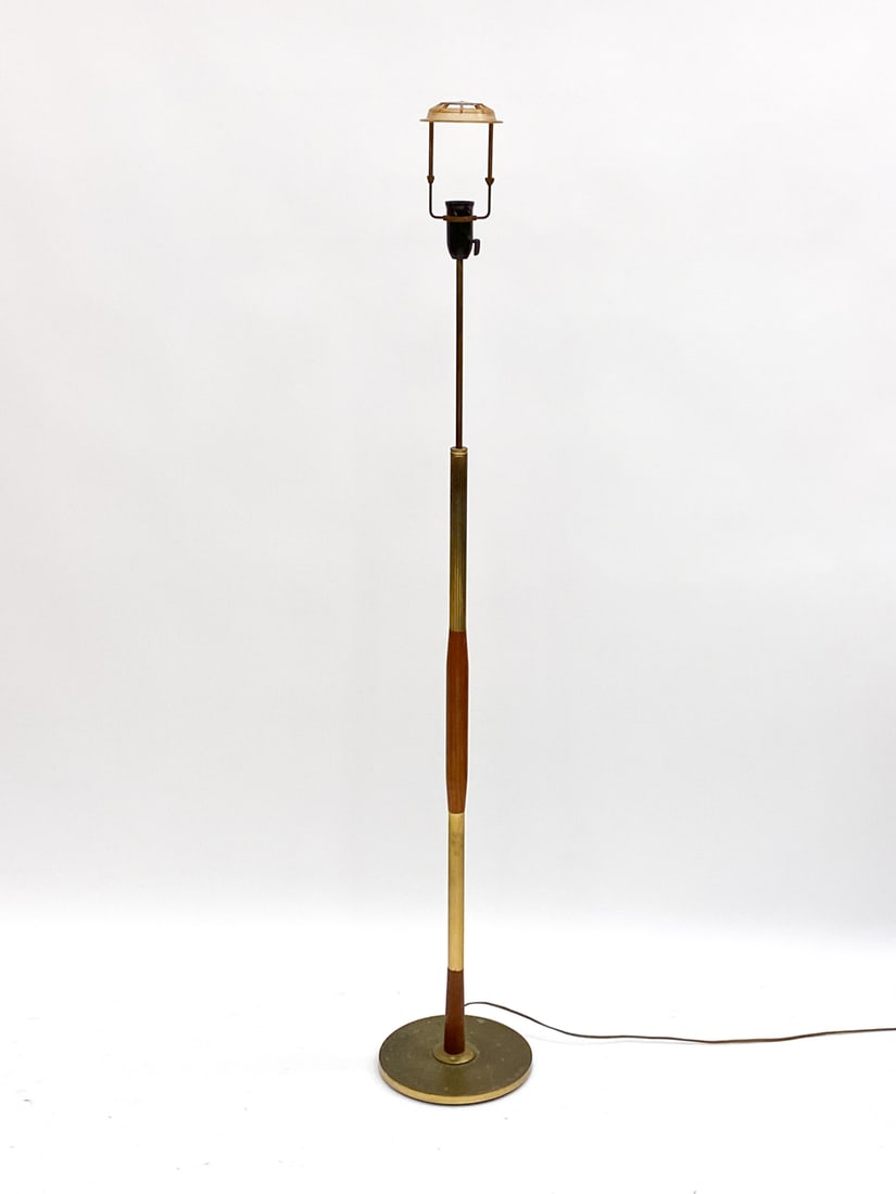 DANISH BRASS & TEAK LAMP. C 1960'S: Brass covered iron base. No shade Dimensions:H (to top of harp) 58" x Dia 9.75" Condition: Patina to brass. Wear consistent with age and use. Not tested. Cut Wire, will require rewiring. F061
