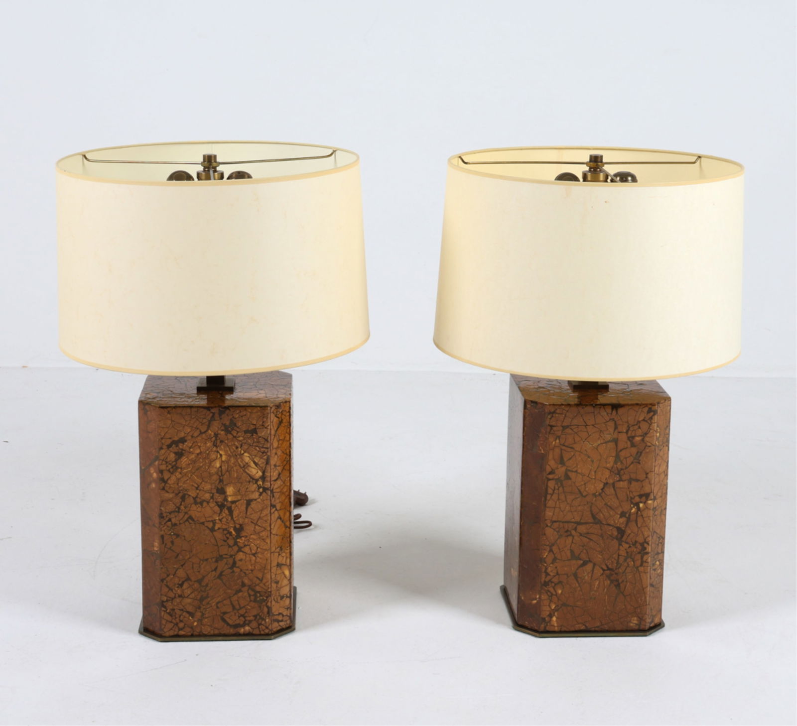 MANNER OF KARL SPRINGER COCONUT SHELL LAMPS: With brass mounts. Felt lined bottom. Late 20th century. Dimensions: H 26.5" x Dia. 17". Condition: Wiring untested. Minor scuffs and scratches to brass finish. TICK071