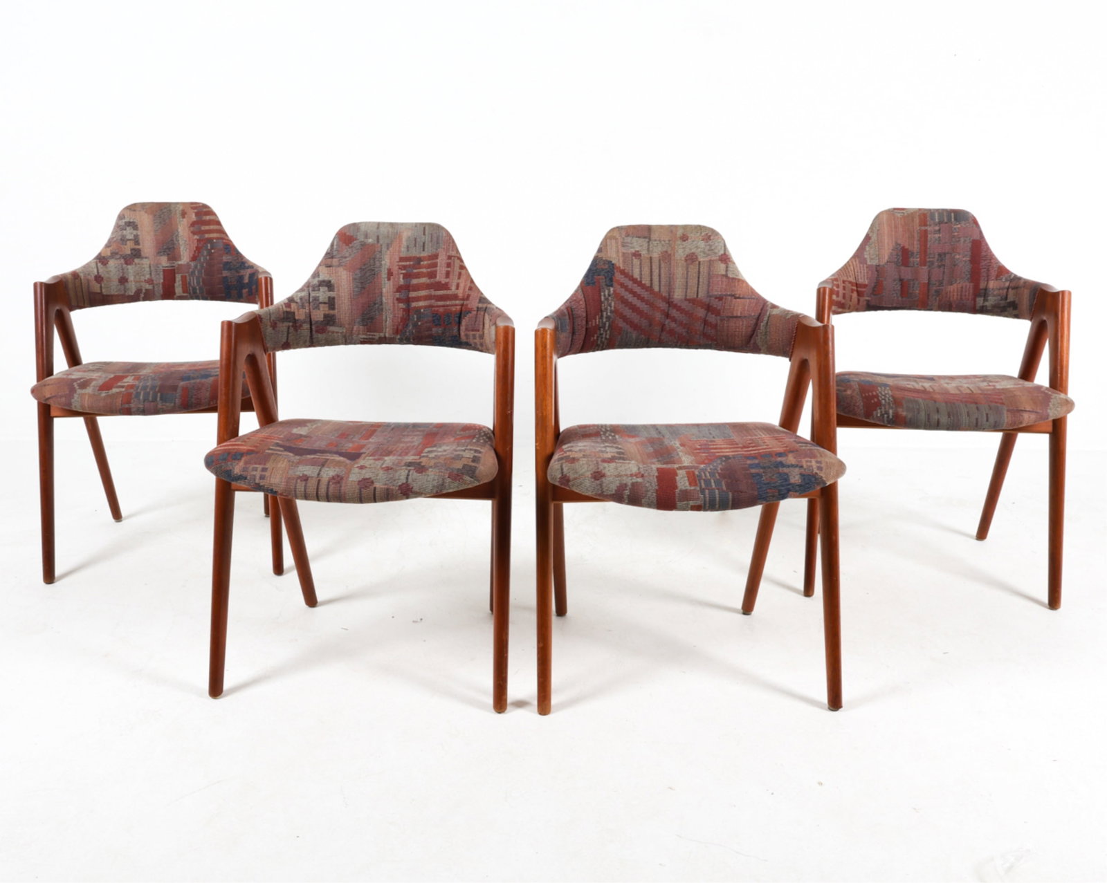 'KOMPASS' TEAK CHAIRS BY KAI KRISTIANSEN, C.1960'S: Fabric upholstery. Denmark. Dimensions: H 31" x W 20.5" x D 17.25" x SH 16.75". Condition: Minor wear to fabric, some loose threads. Minor scuffs and small scratches. Wear consistent with age and use.