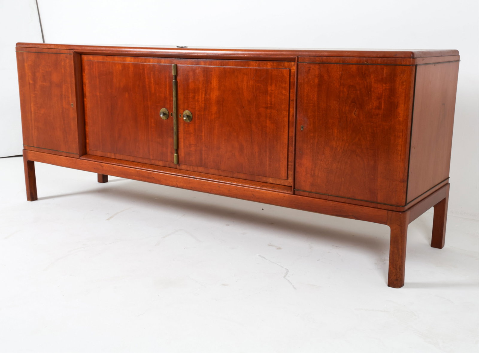 DANISH MODERN MOHOGANY SIDEBOARD: Key included. Brass fittings. Dimensions: H 32.25" x W 80.5" x D 22". Condition: Few scuffs and scratches. Wear consistent with age and use. DMJ119