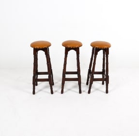 (3) VINTAGE BRASS TACKED BAR STOOLS