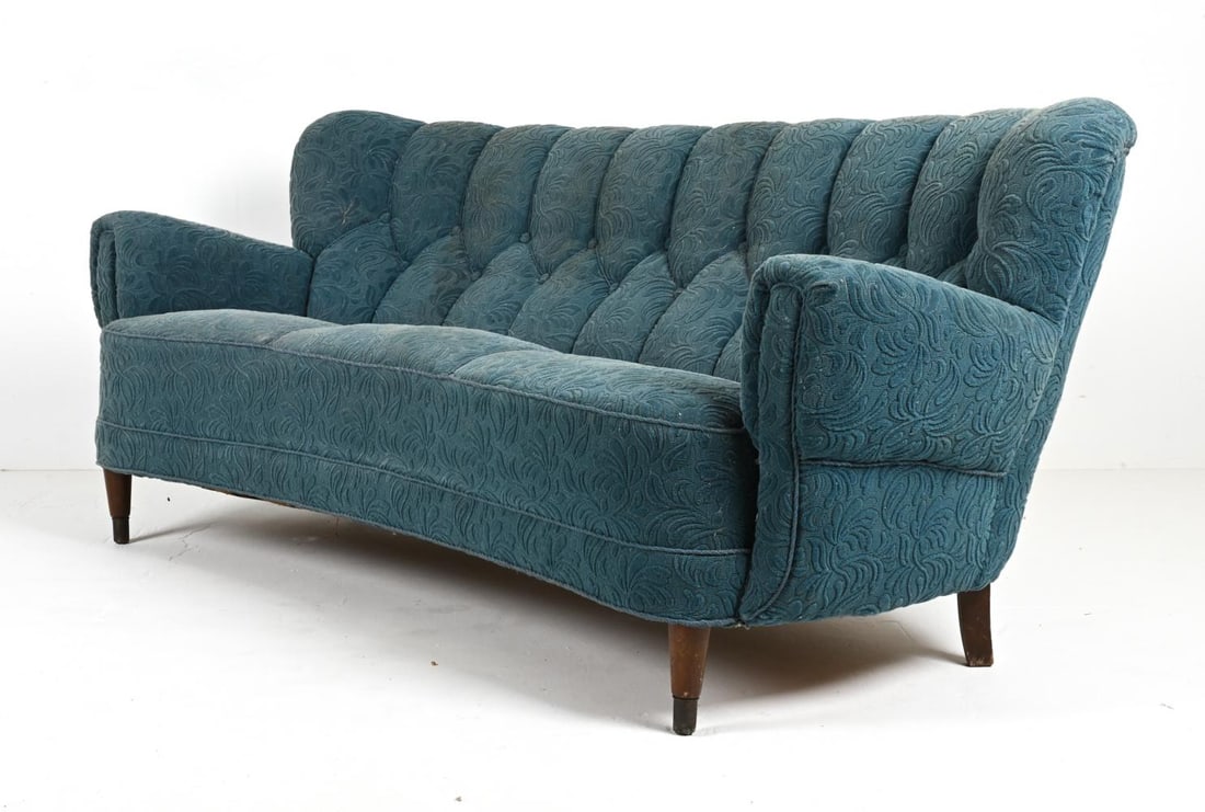 DANISH SOFA IN THE STYLE OF FLEMMING LASSEN: Journey into a world where design meets dream with this captivating Danish Mid-Century Sofa, channeling the evocative style of the legendary Flemming Lassen. A relic from the radiant 1940s, this piece