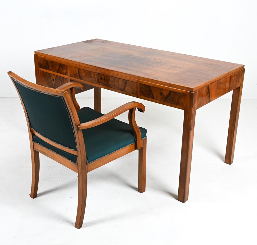 ROSEWOOD DESK & ARMCHAIR BY ERIK WORTS: Dive into a realm of unparalleled craftsmanship and timeless elegance with this rare Erik Worts Danish Mid-Century Rosewood Desk and Armchair ensemble. A true embodiment of 20th-century Scandinavian d